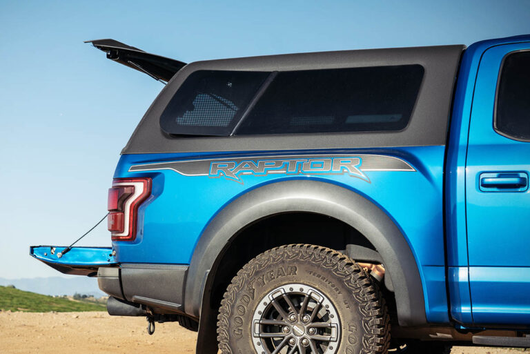 blue ford f150 raptor with polyfuse truck cap